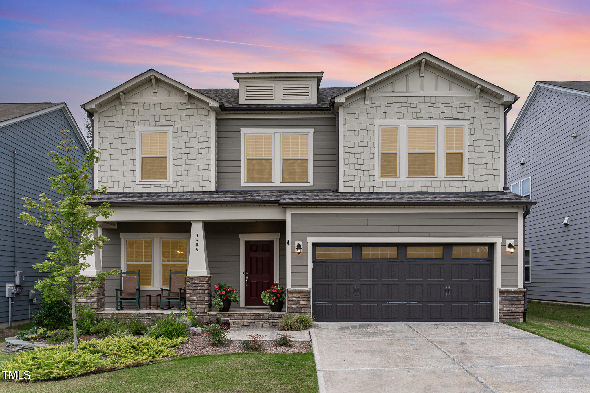 3405 Barn Road Apex, NC 27502 - Photo 2 of 38 a front view of a house with a yard and garage