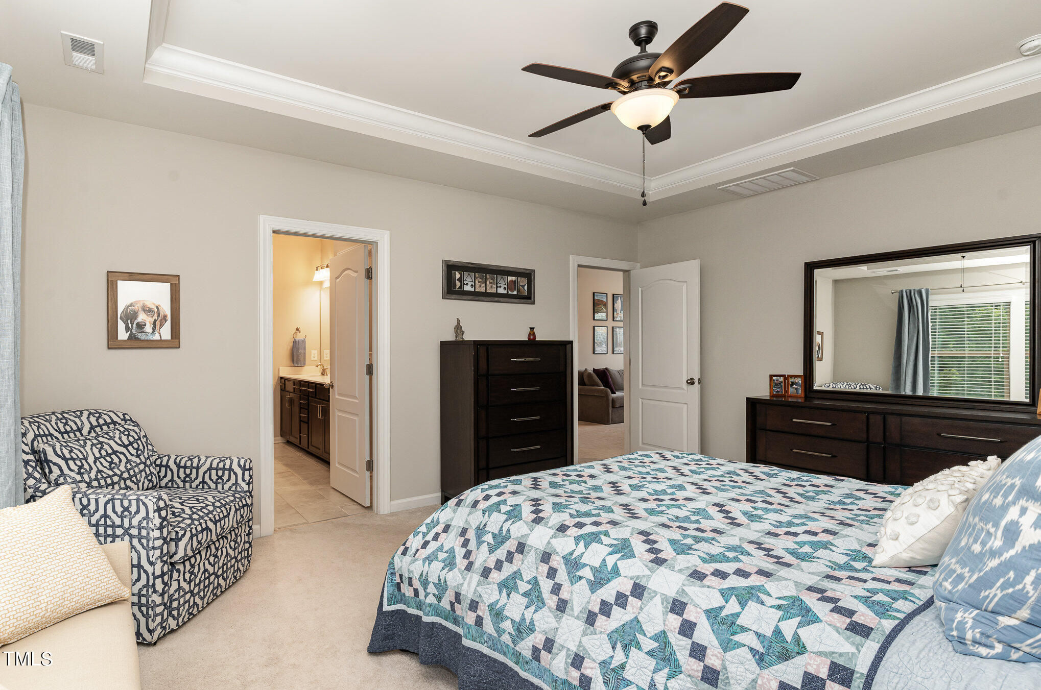 3405 Barn Road Apex, NC 27502 - Photo 22 of 38 a bedroom with a bed and a dresser