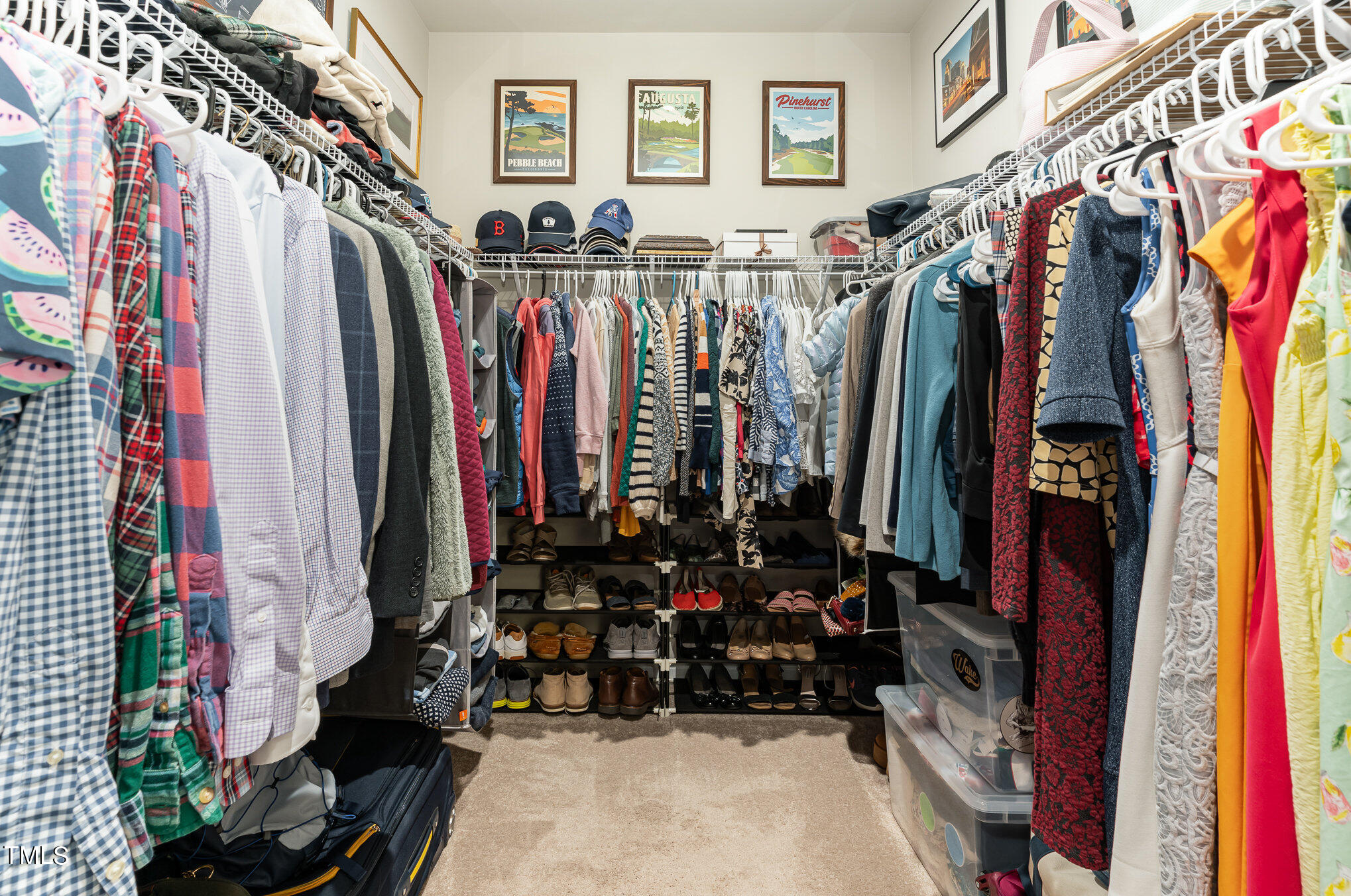3405 Barn Road Apex, NC 27502 - Photo 25 of 38 a view of walk in closet with clothes