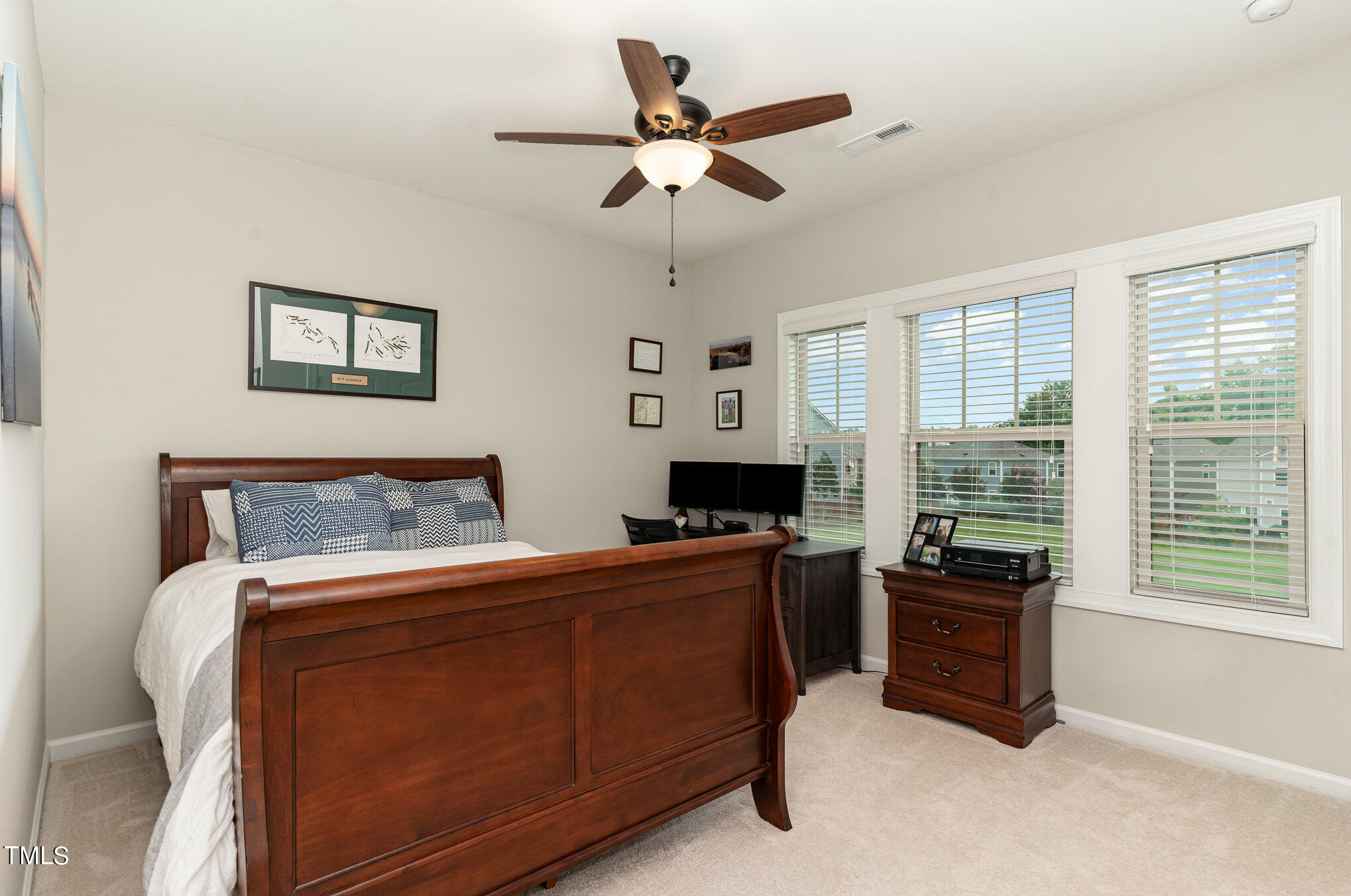 3405 Barn Road Apex, NC 27502 - Photo 28 of 38 a bed room with a bed and a television