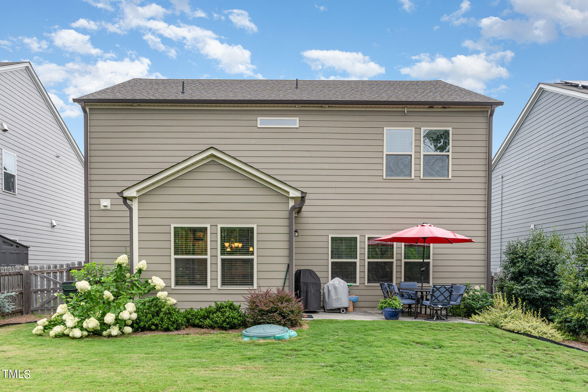 3405 Barn Road Apex, NC 27502 - Photo 33 of 38 a view of a house with sitting area and garden