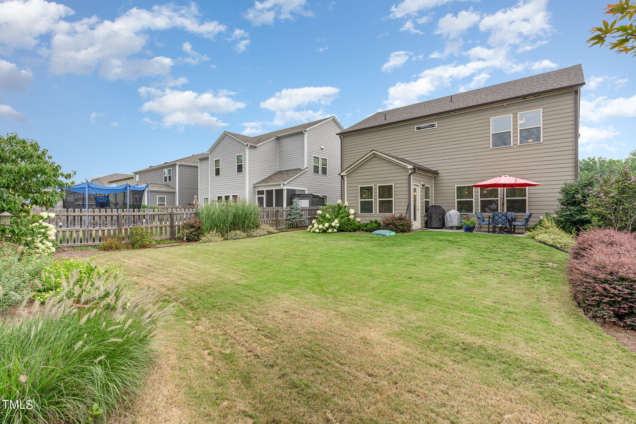 3405 Barn Road Apex, NC 27502 - Photo 34 of 38 a front view of house with yard and green space