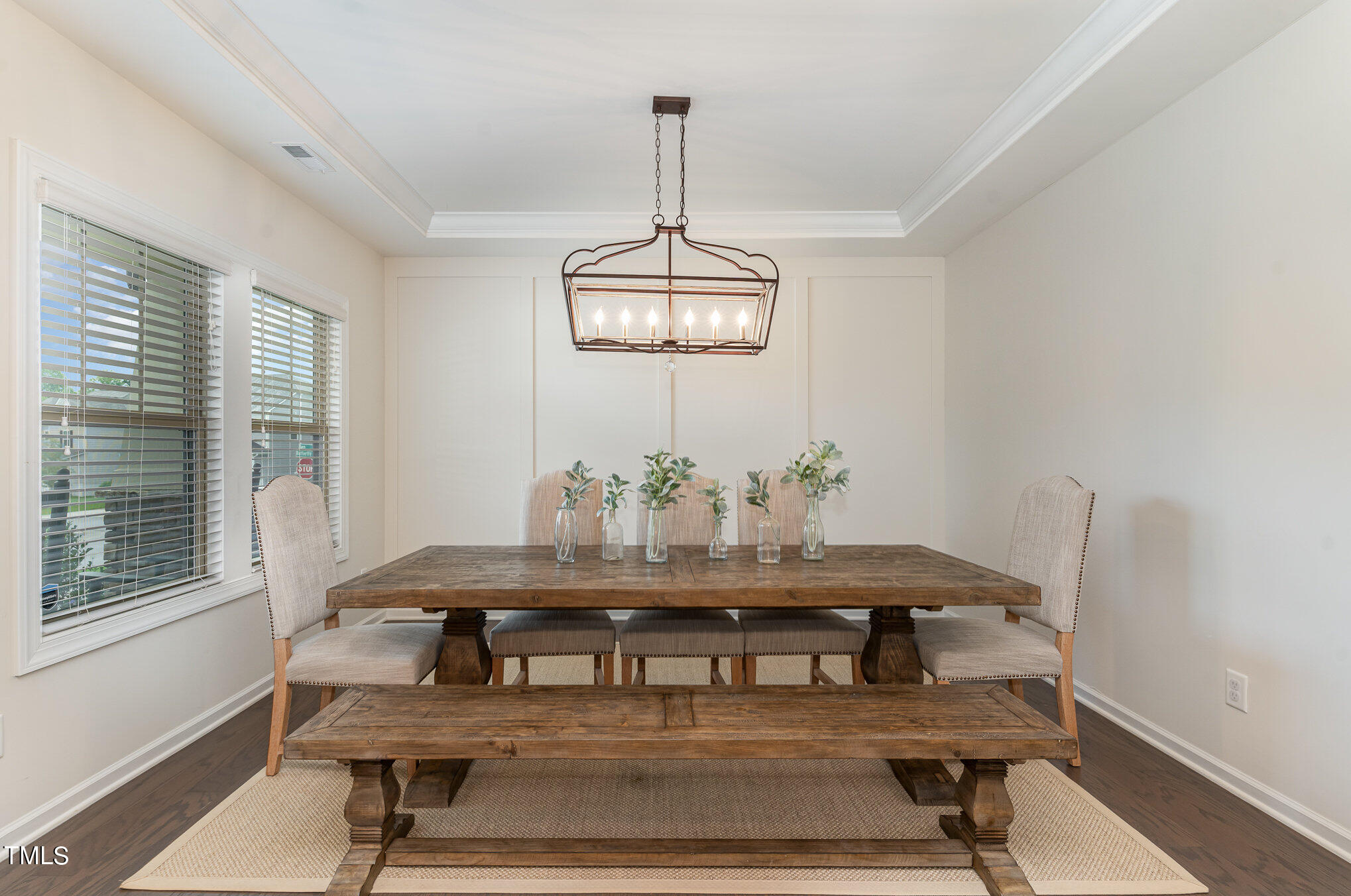 3405 Barn Road Apex, NC 27502 - Photo 7 of 38 a view of a dining room with furniture window and wooden floor