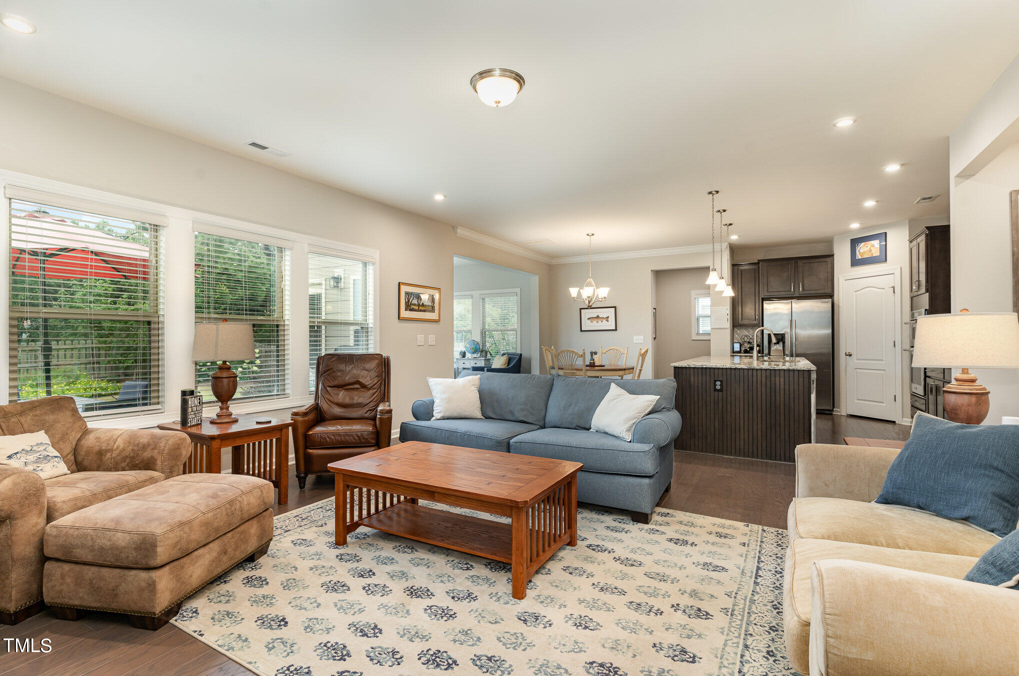 3405 Barn Road Apex, NC 27502 - Photo 9 of 38 a living room with furniture wooden floor and a large window