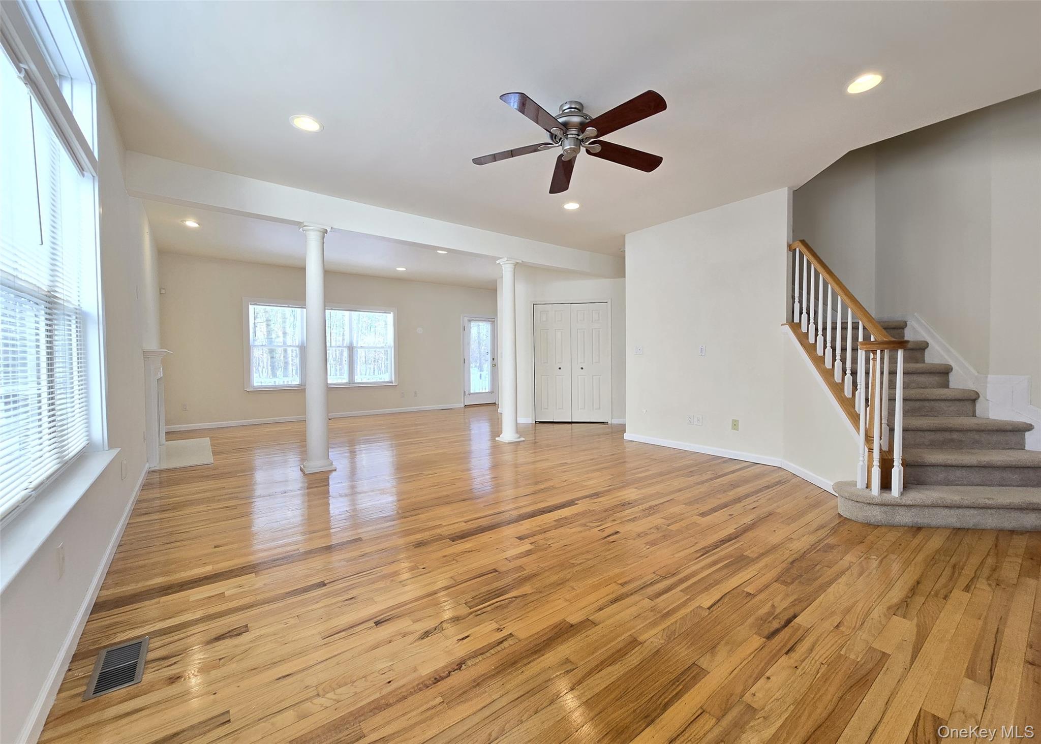 63 Sunflower Ridge Road Centereach, NY 11720 - Photo 2 of 23 a view of empty room with wooden floor and fan