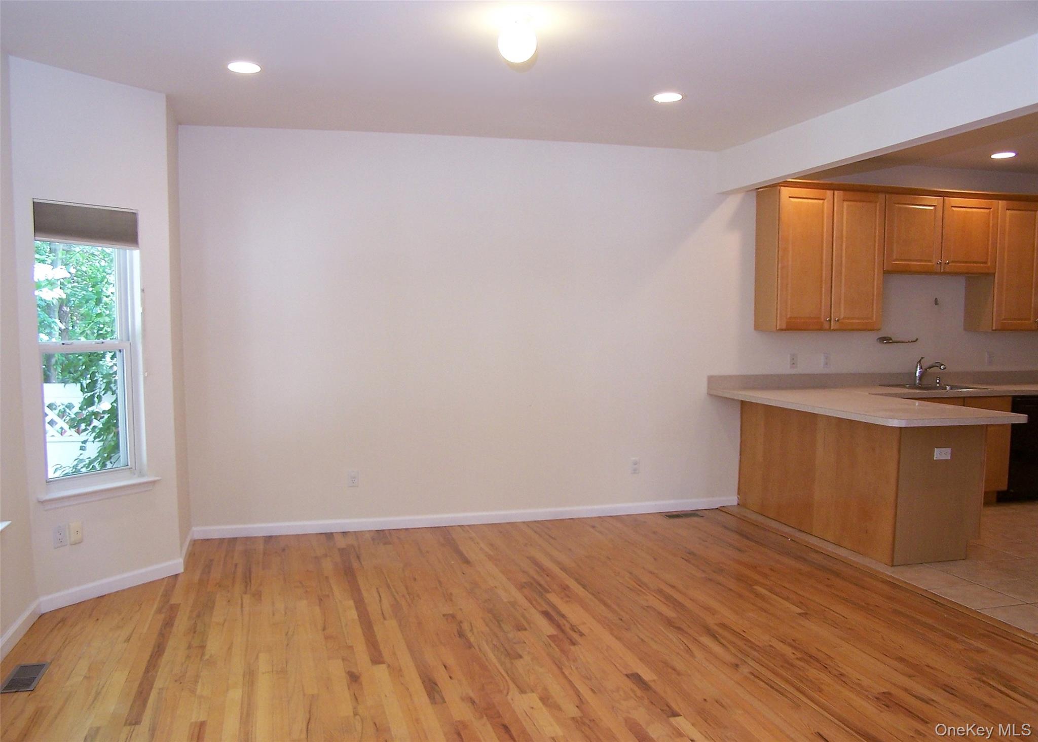 63 Sunflower Ridge Road Centereach, NY 11720 - Photo 8 of 24 a view of a kitchen with a sink and a window