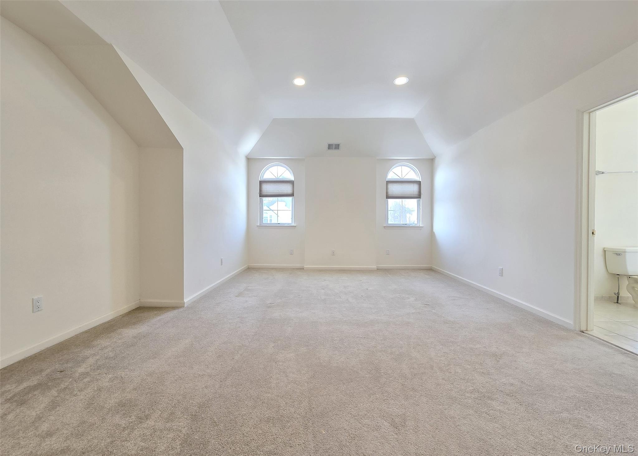 63 Sunflower Ridge Road Centereach, NY 11720 - Photo 9 of 23 an empty room with windows and closet