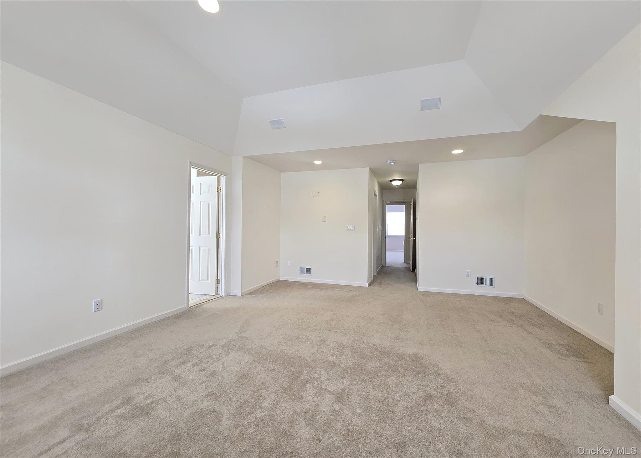 63 Sunflower Ridge Road Centereach, NY 11720 - Photo 10 of 23 a view of an empty room with a kitchen