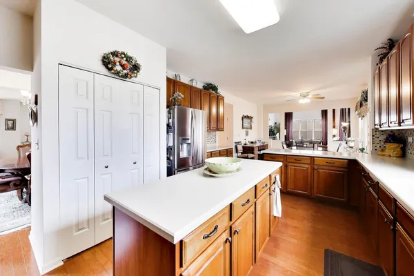 a kitchen with white cabinets and appliances