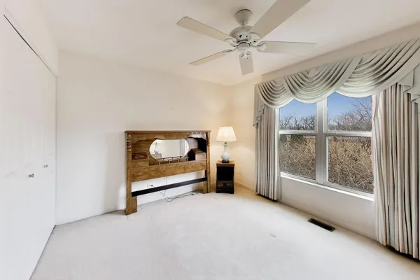 a view of a room with furniture window and a ceiling fan
