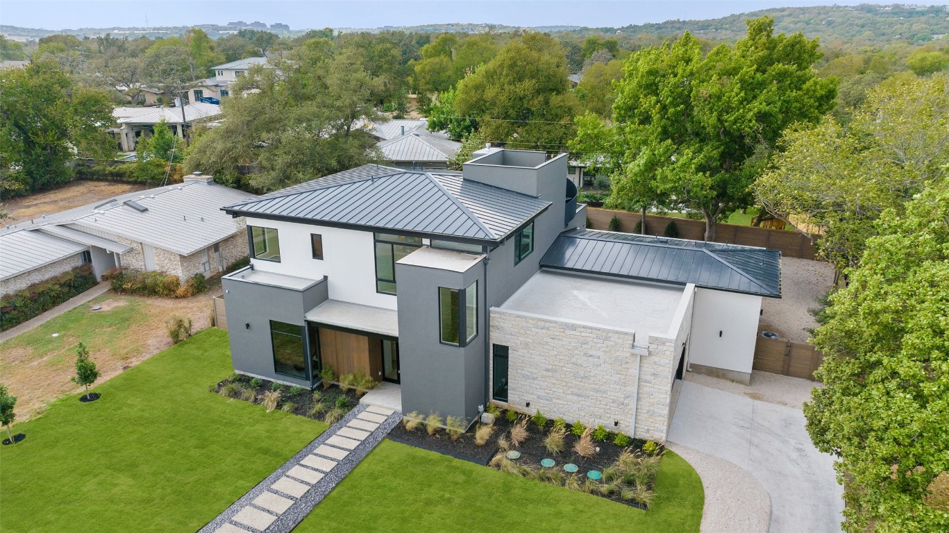 304 Blue Ridge Trail Austin, TX 78746 - Photo 14 of 40 an aerial view of a house with swimming pool and garden