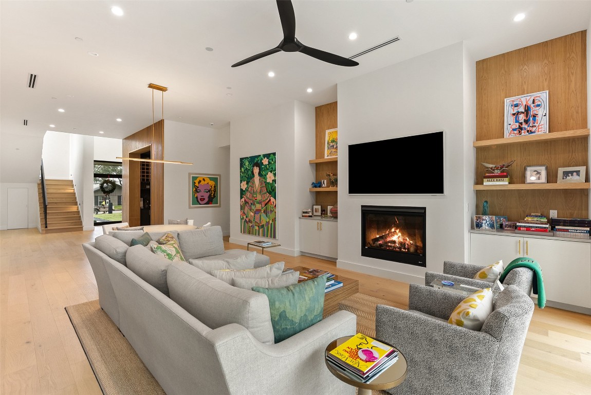 304 Blue Ridge Trail Austin, TX 78746 - Photo 15 of 40 a living room with furniture and a fireplace