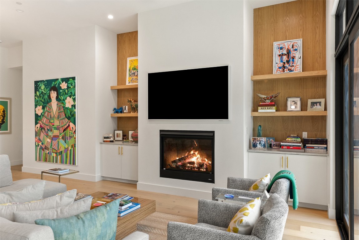 304 Blue Ridge Trail Austin, TX 78746 - Photo 16 of 40 a living room with furniture and a fireplace