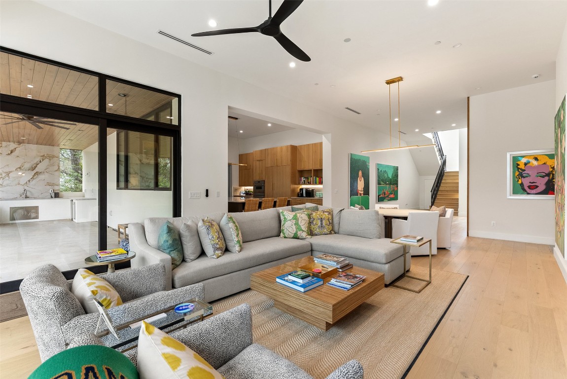 304 Blue Ridge Trail Austin, TX 78746 - Photo 17 of 40 a living room with furniture kitchen view and a large window
