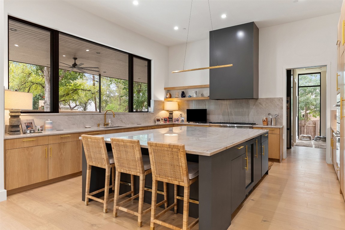 304 Blue Ridge Trail Austin, TX 78746 - Photo 20 of 40 a kitchen with granite countertop a sink a counter top space and stainless steel appliances