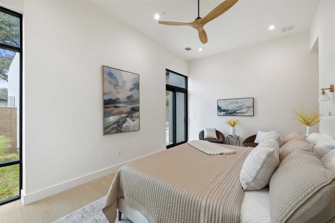 304 Blue Ridge Trail Austin, TX 78746 - Photo 36 of 40 a bedroom with a bed and a painting on the wall