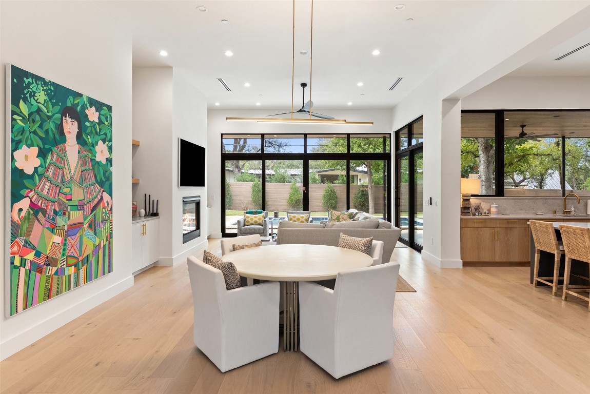 304 Blue Ridge Trail Austin, TX 78746 - Photo 6 of 40 a dining hall with stainless steel appliances kitchen island granite countertop a sink and a large window