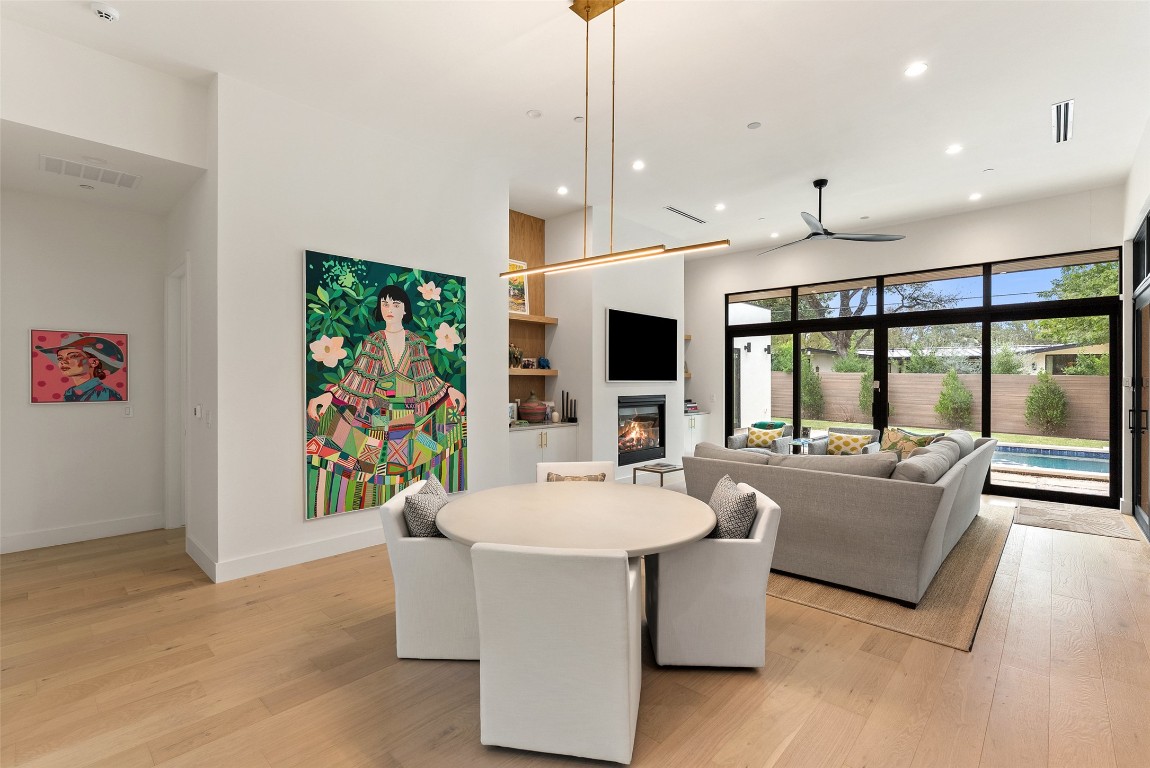 304 Blue Ridge Trail Austin, TX 78746 - Photo 8 of 40 a living room with furniture a flat screen tv and a large window