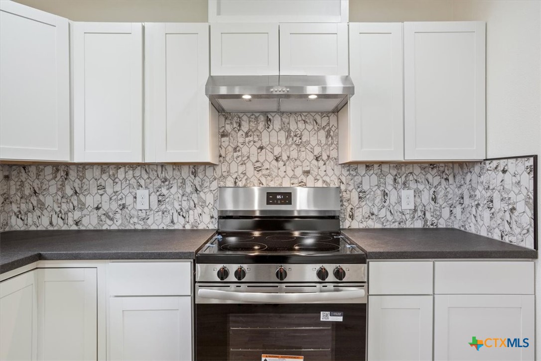 707 South 13th Street Temple, TX 76504 - Photo 10 of 24 a stove top oven sitting inside of a kitchen