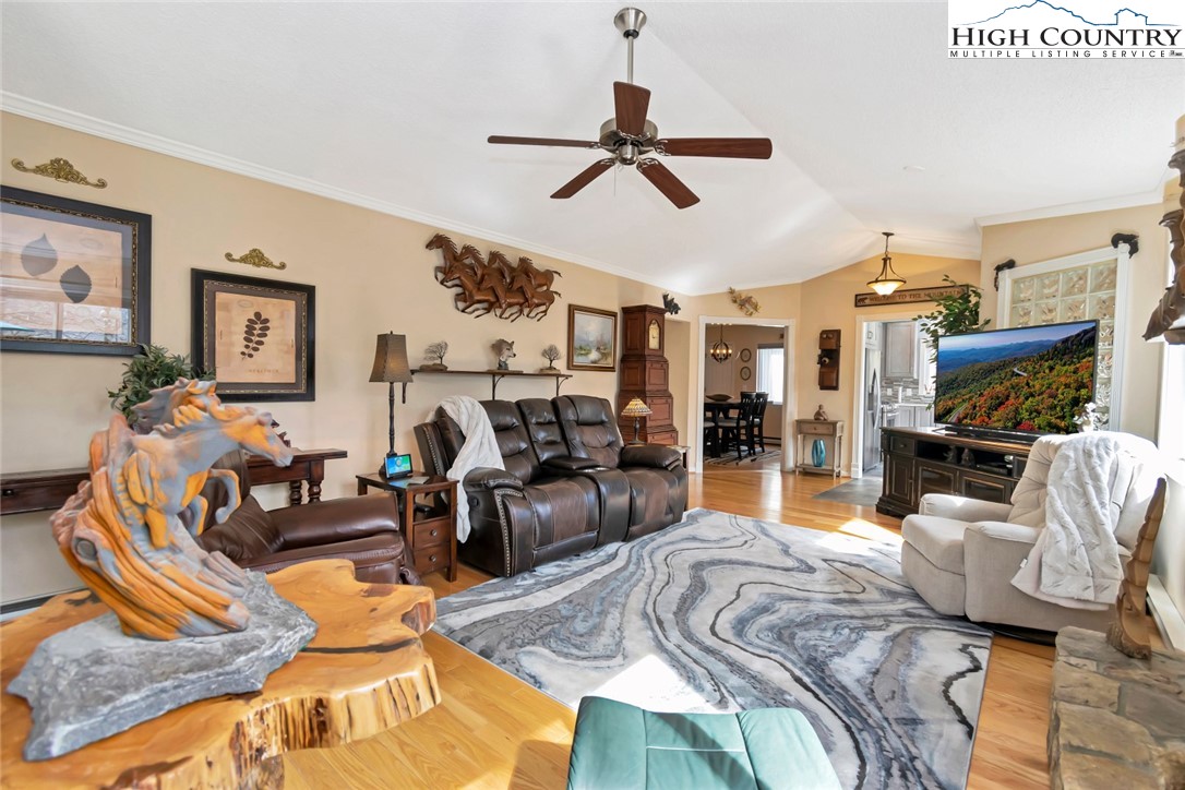 194 Woodwinds Circle Seven Devils, NC 28604 - Photo 15 of 50 a living room with furniture a ceiling fan and a rug