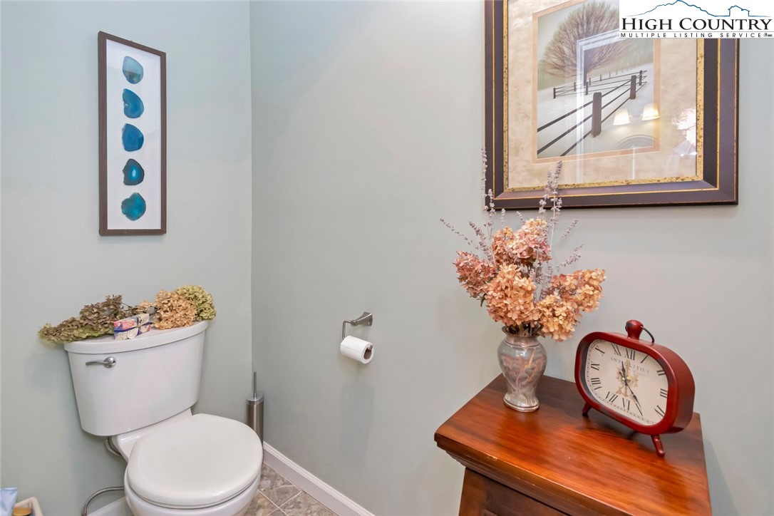 194 Woodwinds Circle Seven Devils, NC 28604 - Photo 33 of 50 a bathroom with a toilet and a sink