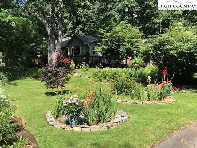 194 Woodwinds Circle Seven Devils, NC 28604 - Photo 46 of 50 a front view of a house with a yard