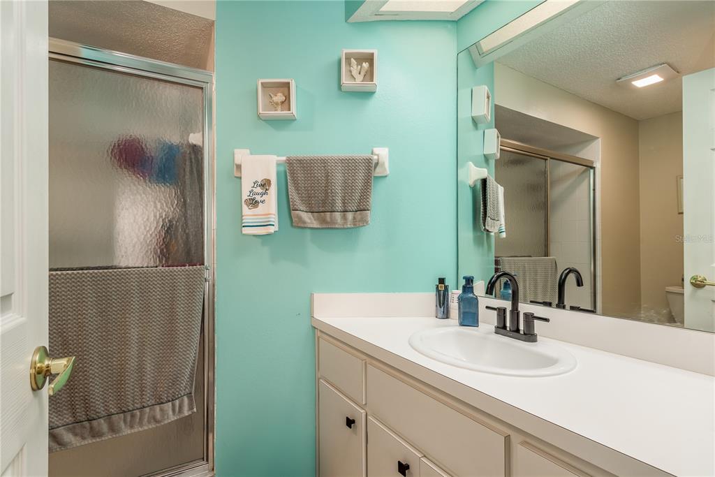 7536 Roland Court New Port Richey, FL 34654 - Photo 9 of 15 a bathroom with a sink and a mirror