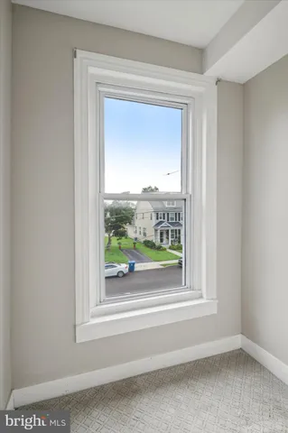 a view of a wooden door and a window
