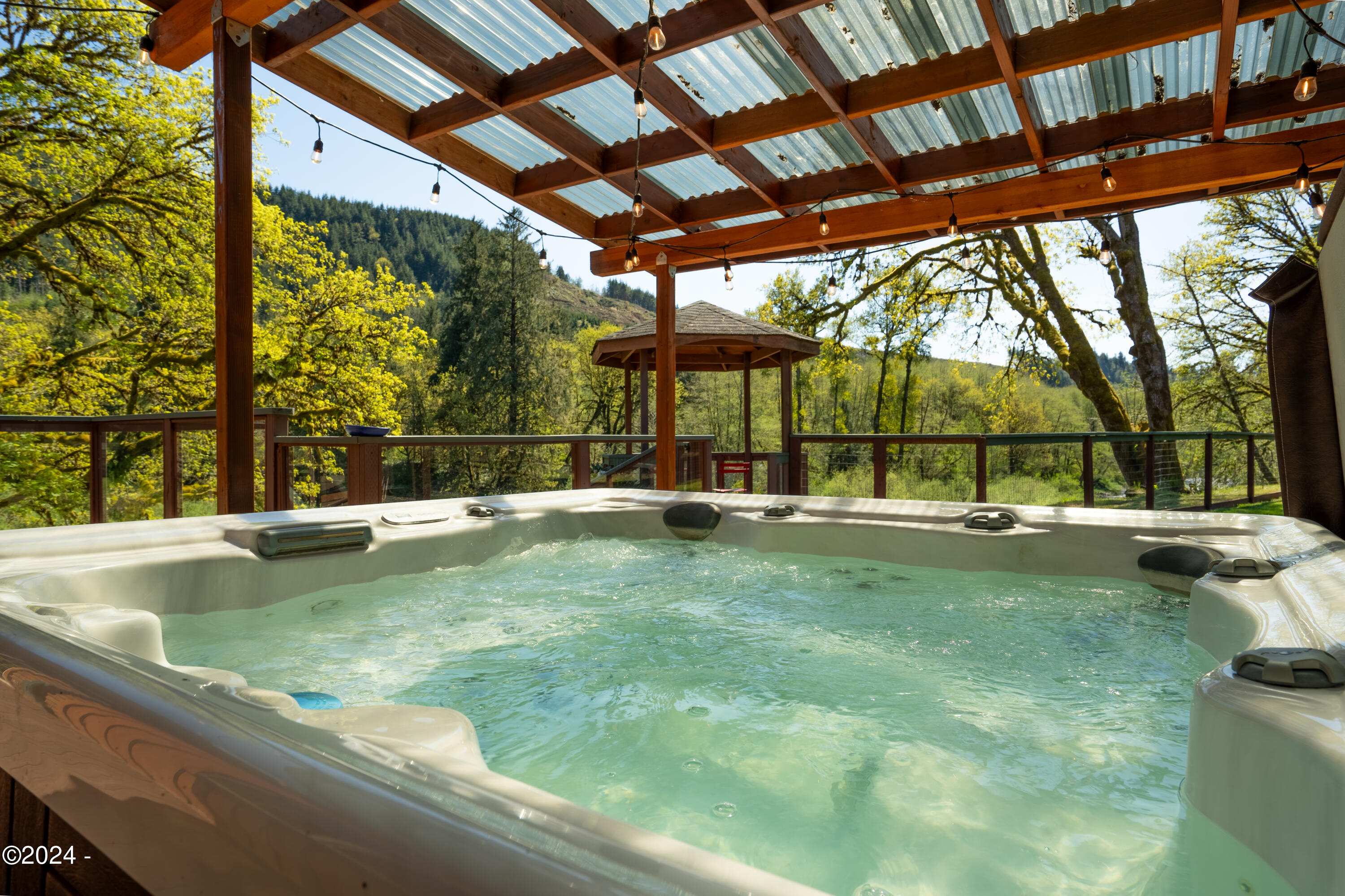 7006 Logsden Road Siletz, OR 97380 - Photo 32 of 74 Covered Patio with Hot Tub