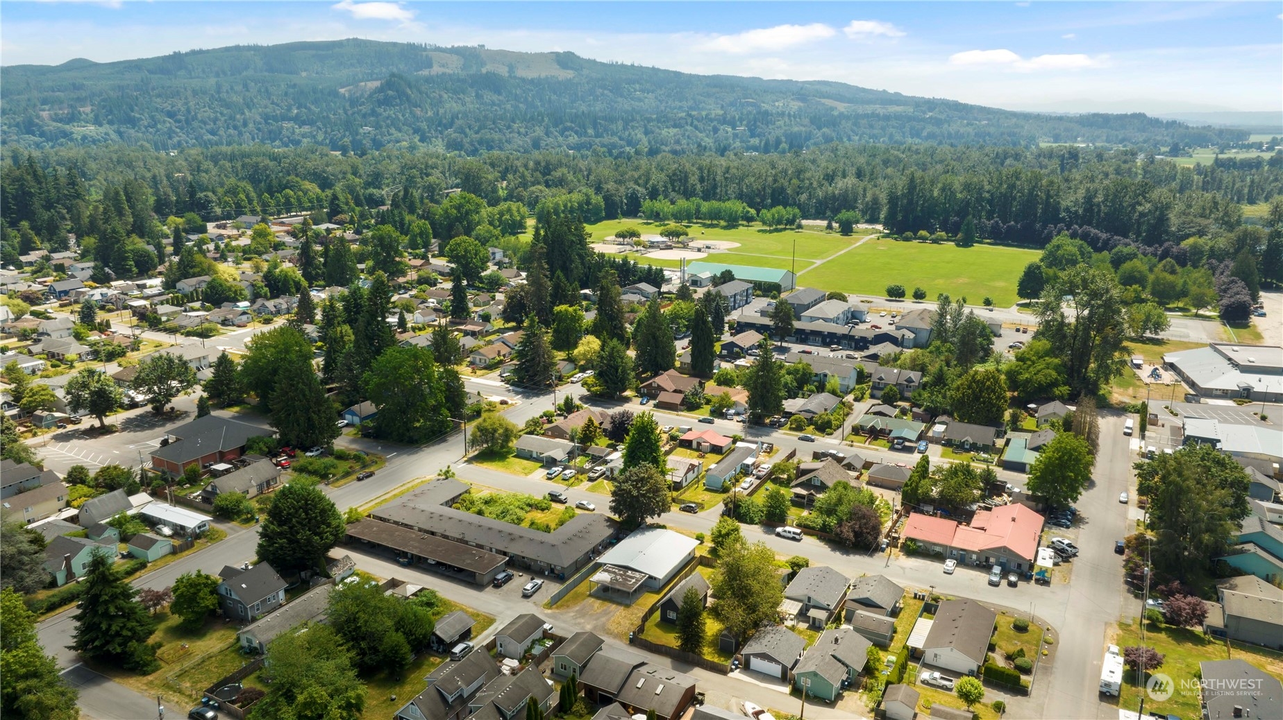 629 Monroe Street Monroe, WA 98272 - Photo 36 of 38 a view of a city with mountains in the background