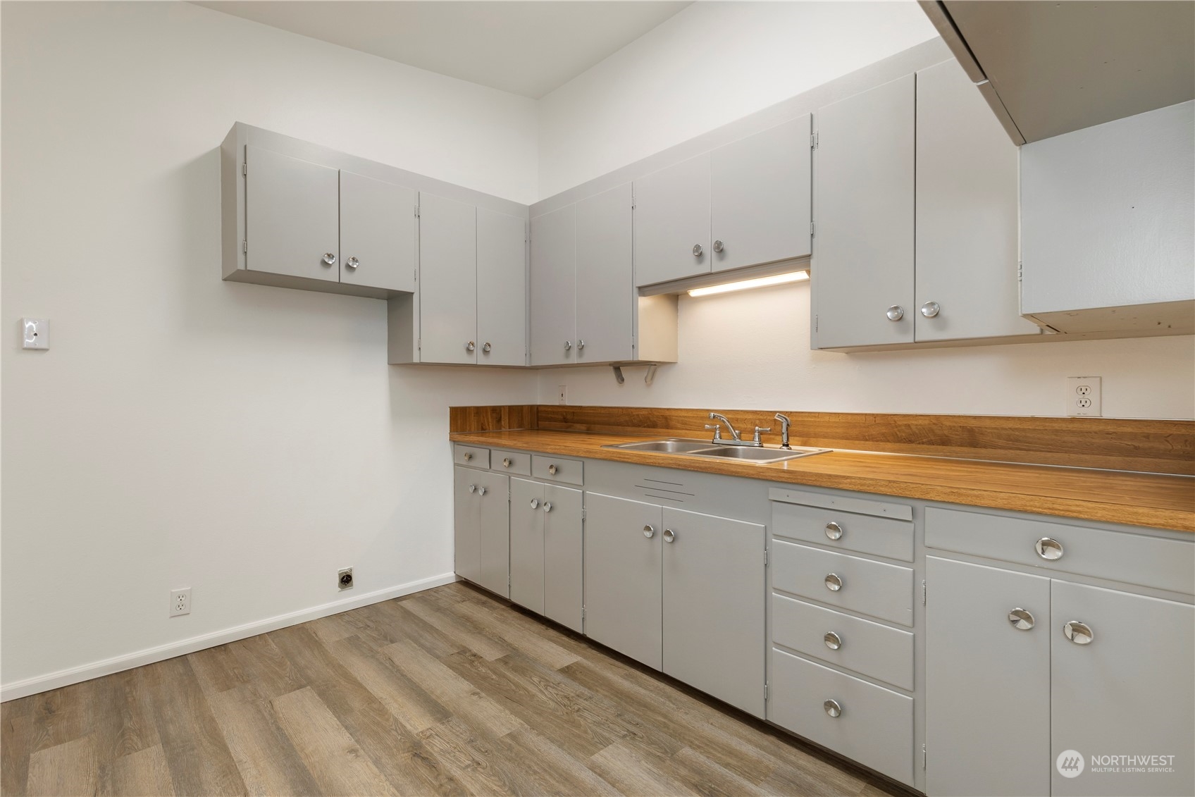 629 Monroe Street Monroe, WA 98272 - Photo 10 of 38 a kitchen with white cabinets and sink