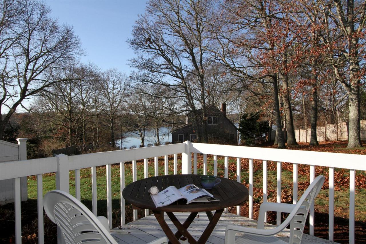 55 Barley Neck Road Orleans, MA 02653 - Photo 1 of 32 a view of a balcony with wooden floor and outdoor seating