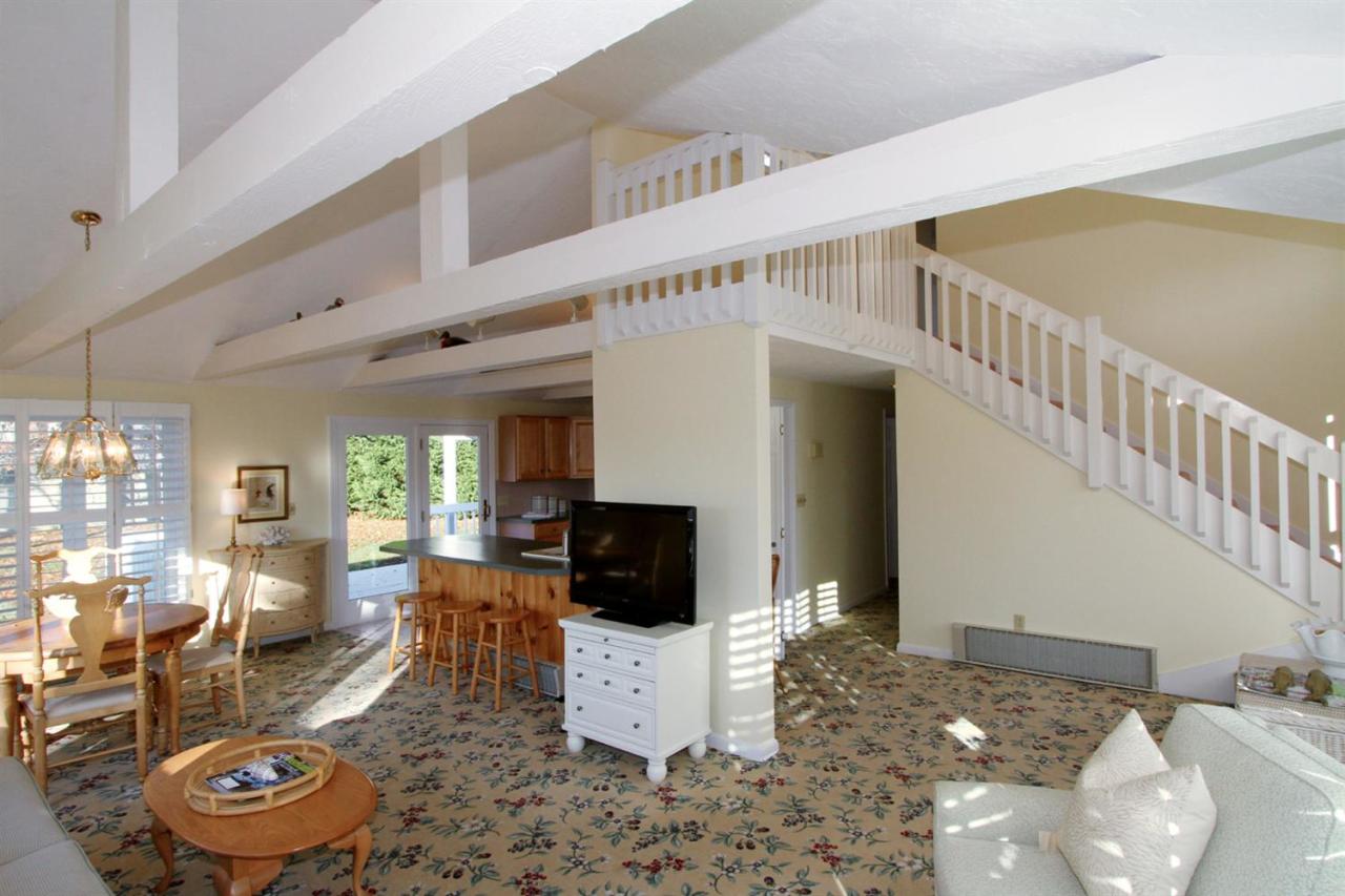 55 Barley Neck Road Orleans, MA 02653 - Photo 12 of 32 a living room with furniture and a flat screen tv