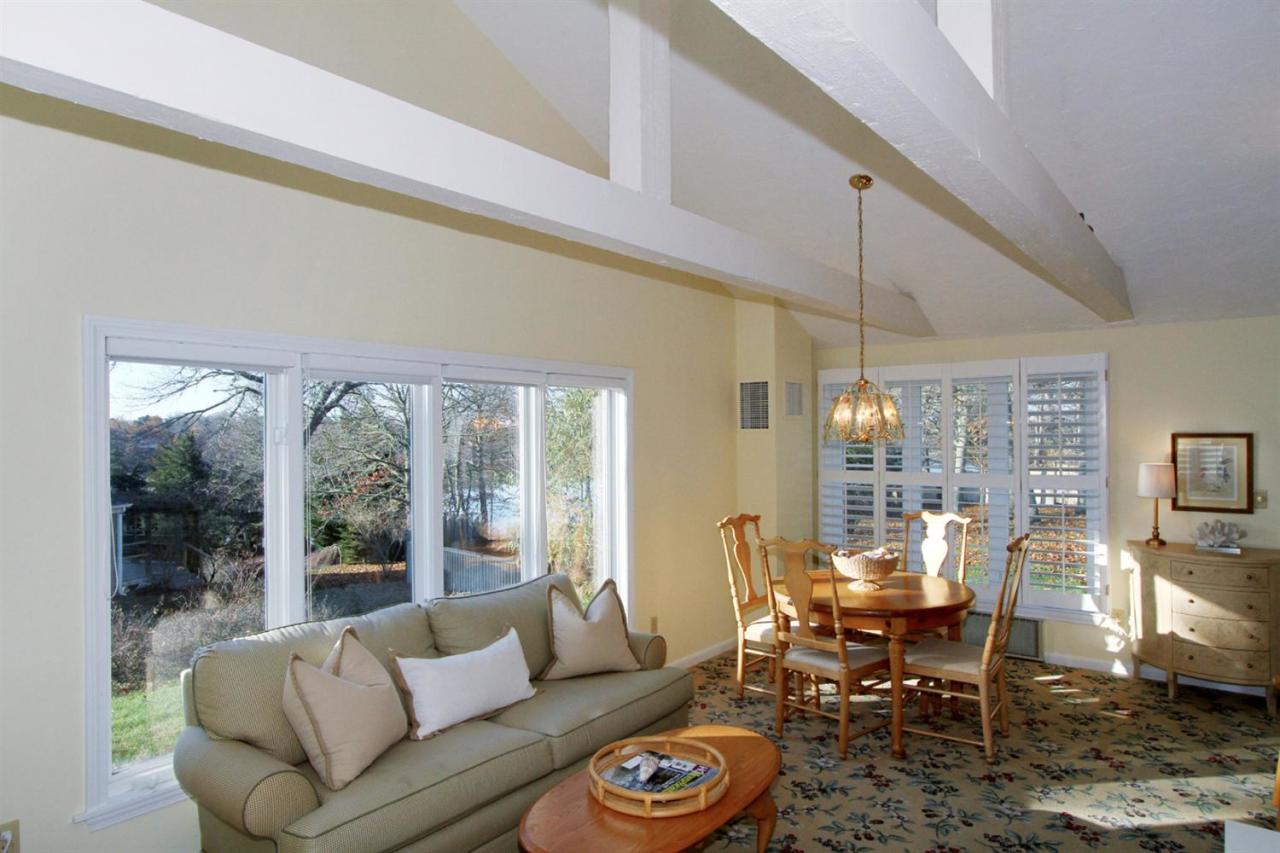 55 Barley Neck Road Orleans, MA 02653 - Photo 16 of 32 a living room with furniture and a large window