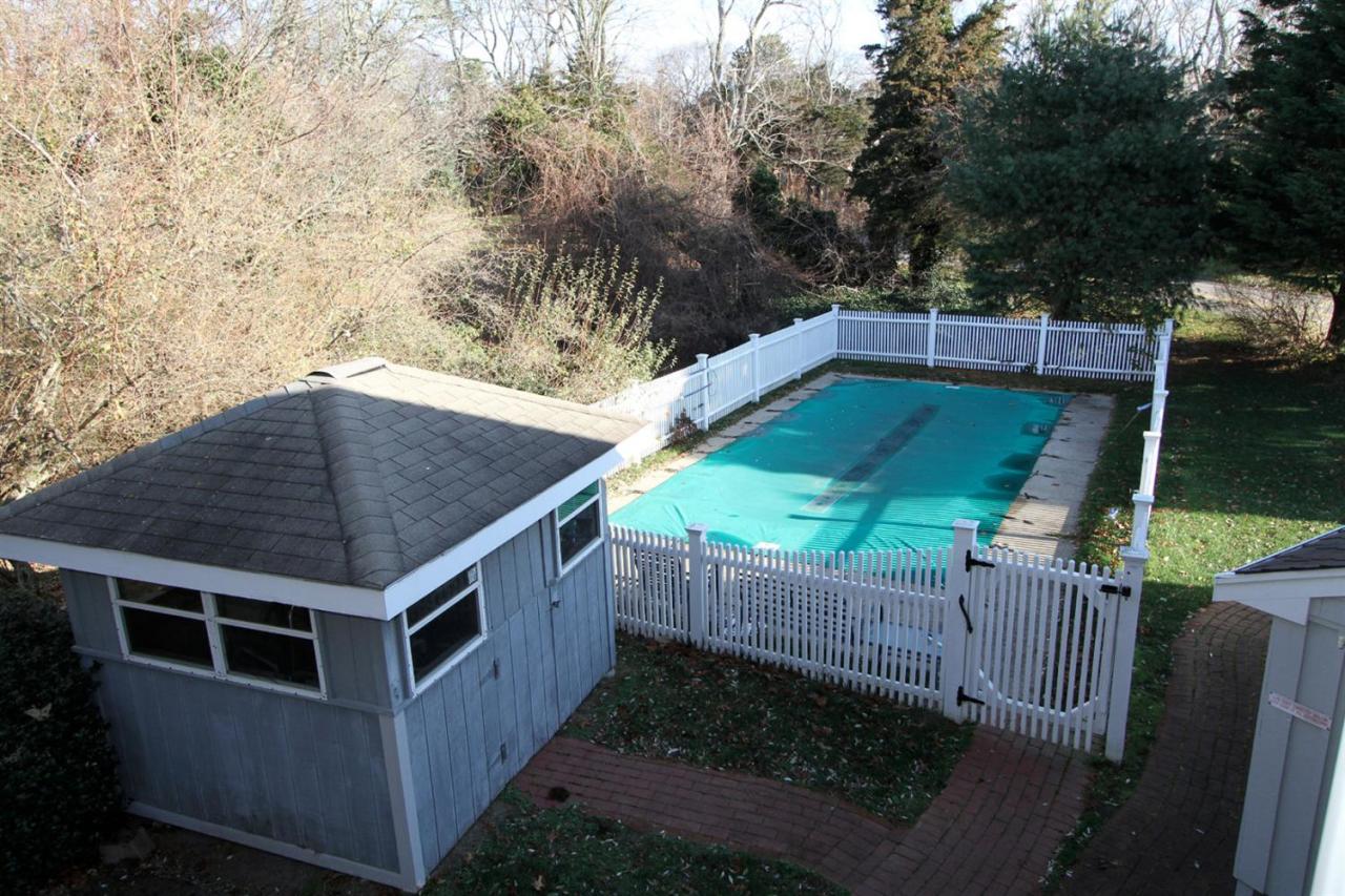 55 Barley Neck Road Orleans, MA 02653 - Photo 6 of 32 a backyard of a house with lots of green space