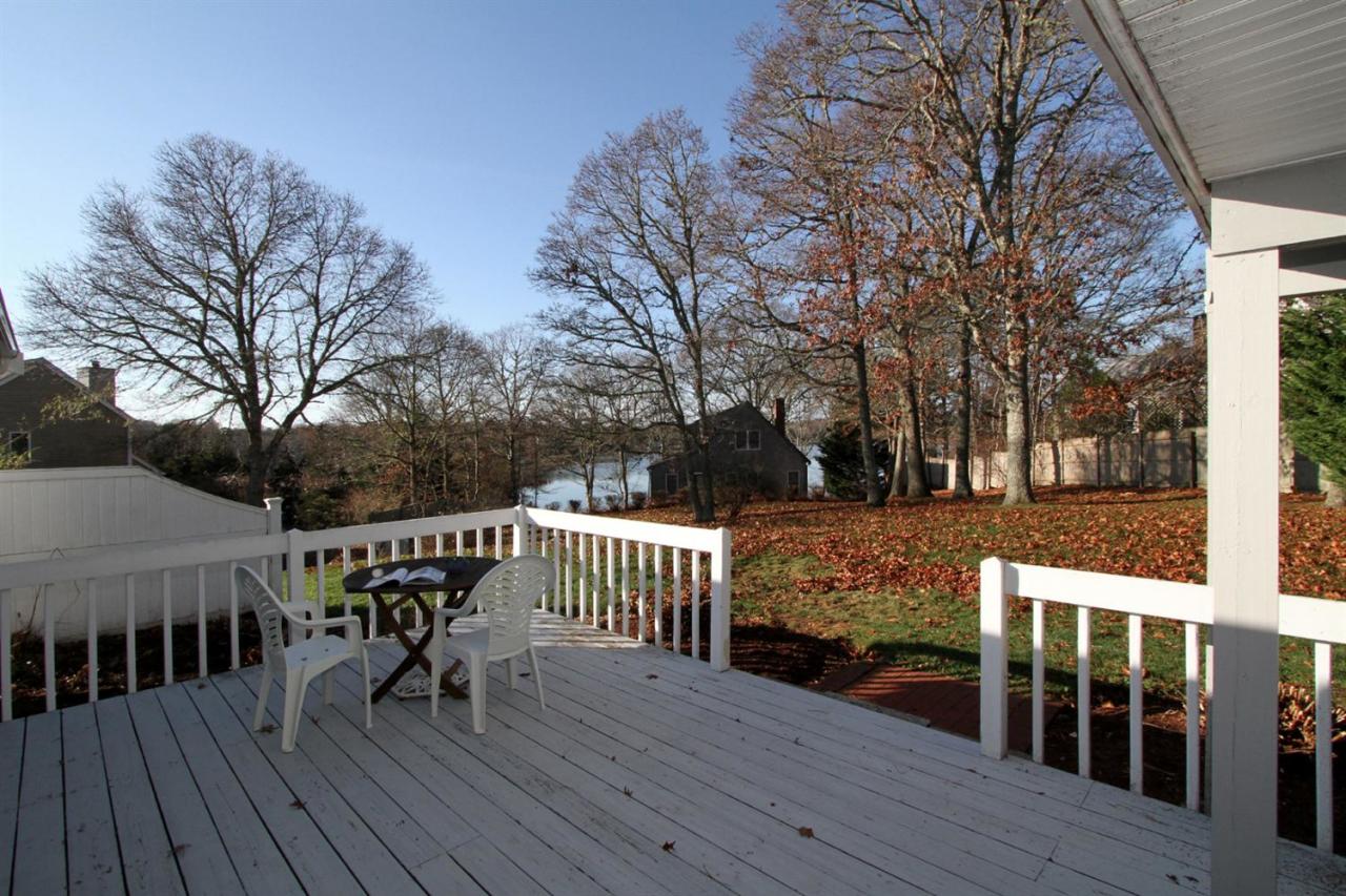 55 Barley Neck Road Orleans, MA 02653 - Photo 9 of 32 a view of a deck with furniture and trees