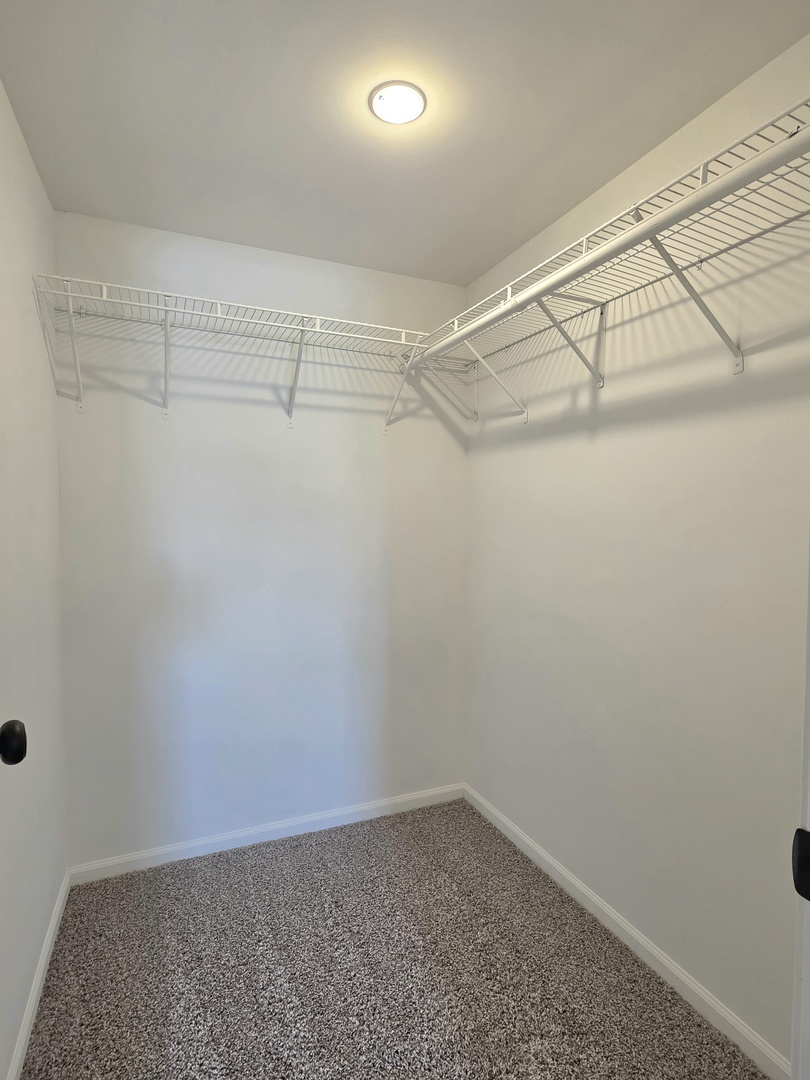 946 West Arlington Lane Crete, IL 60417 - Photo 15 of 27 a view of a room with racks on the wall