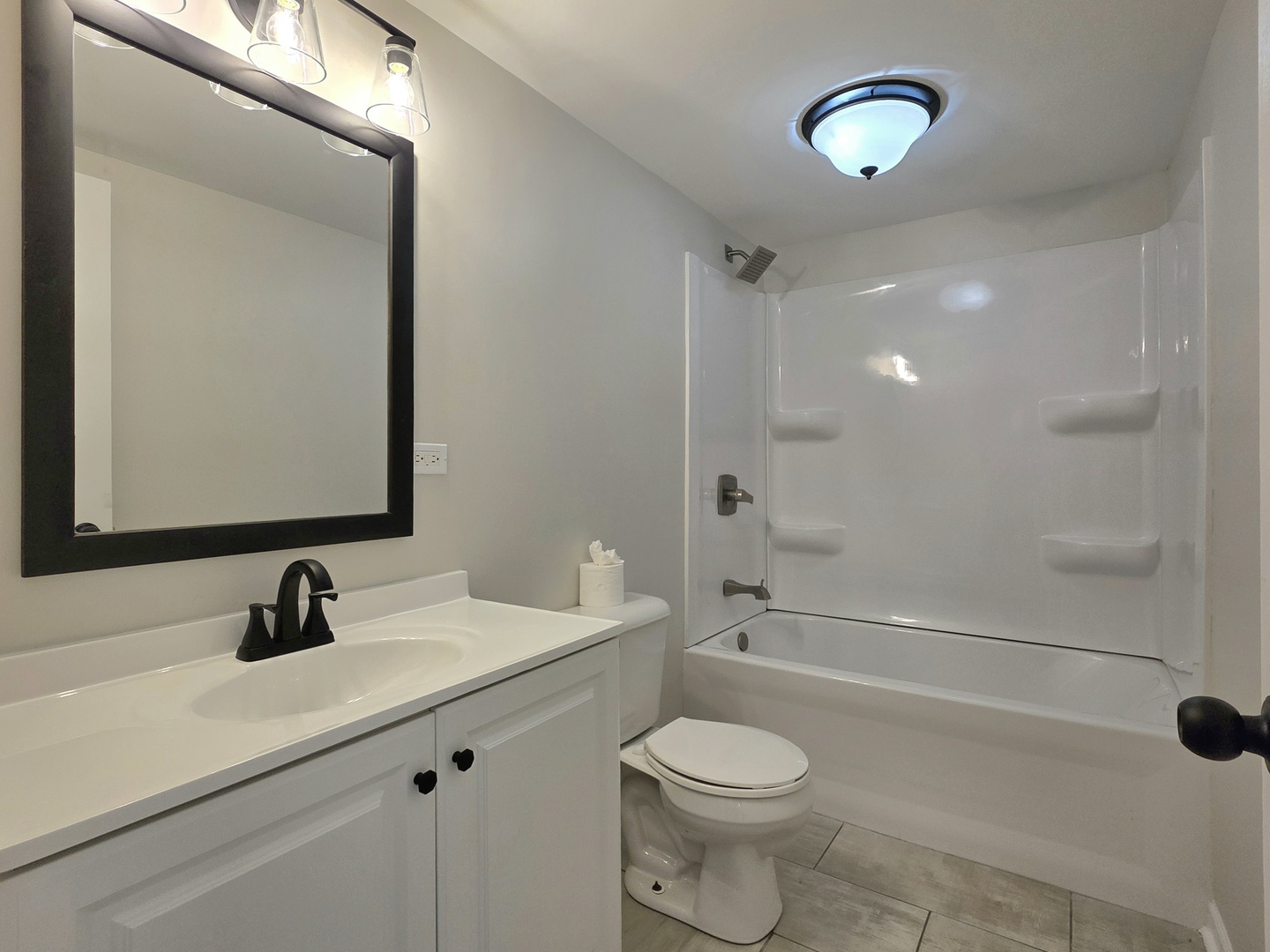 946 West Arlington Lane Crete, IL 60417 - Photo 17 of 27 a bathroom with a sink a toilet and shower