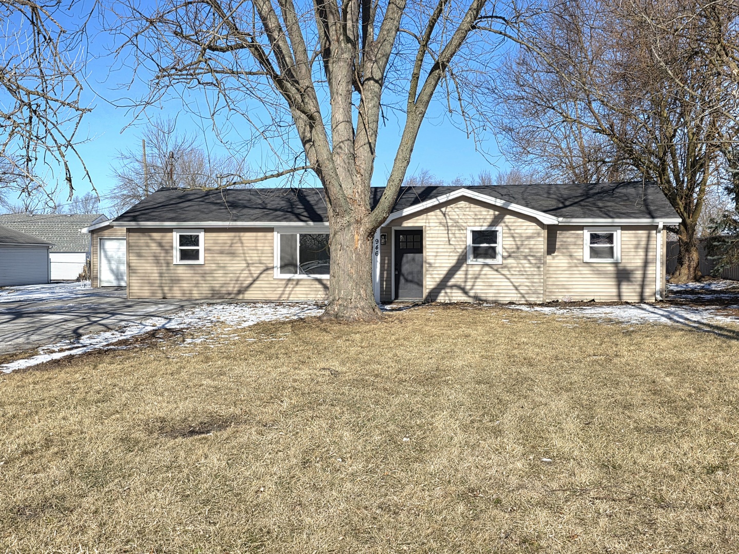 946 West Arlington Lane Crete, IL 60417 - Photo 20 of 27 a front view of a house with large trees