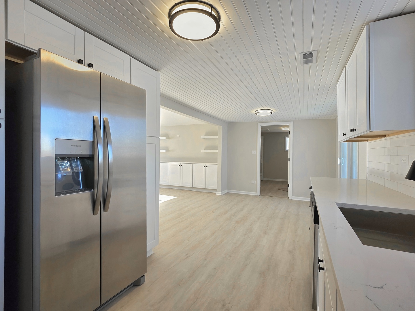 946 West Arlington Lane Crete, IL 60417 - Photo 4 of 27 a kitchen with stainless steel appliances granite countertop a refrigerator and a sink