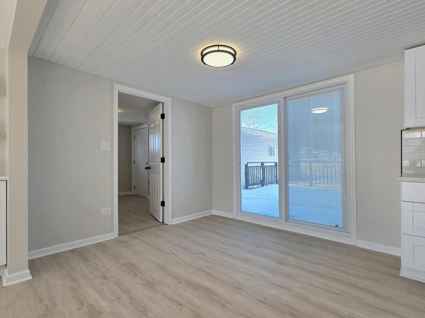 946 West Arlington Lane Crete, IL 60417 - Photo 6 of 27 an empty room with wooden floor and mirror