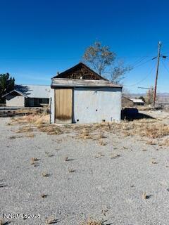 310 Stanley Street Gabbs, NV 89409 - Photo 3 of 3 a view of wooden fence and a building in the background