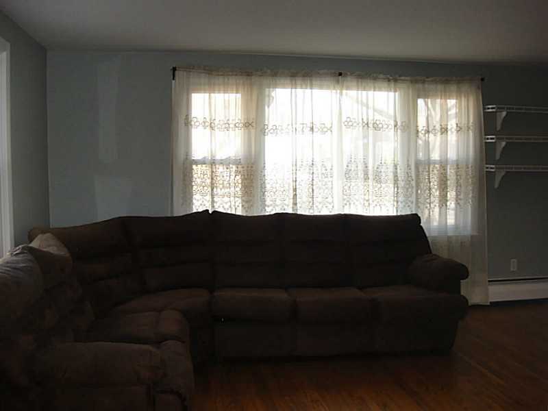 22 Rutherford Court, Unit 22 Warwick, RI 02886 - Photo 6 of 23 Living Room.