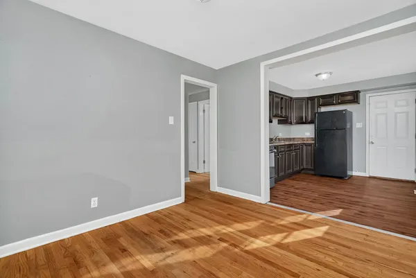 a view of kitchen and refrigerator