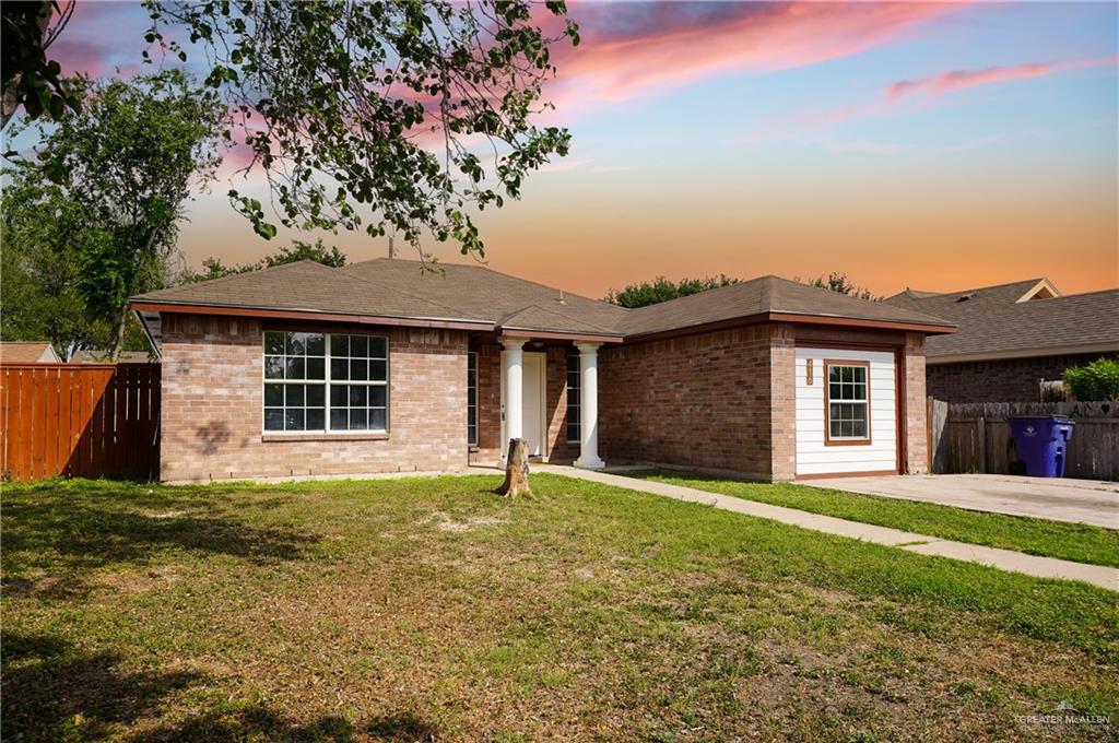 416 Rosa Priego Street Donna, TX 78537 - Photo 1 of 1 a front view of a house with a garden and yard