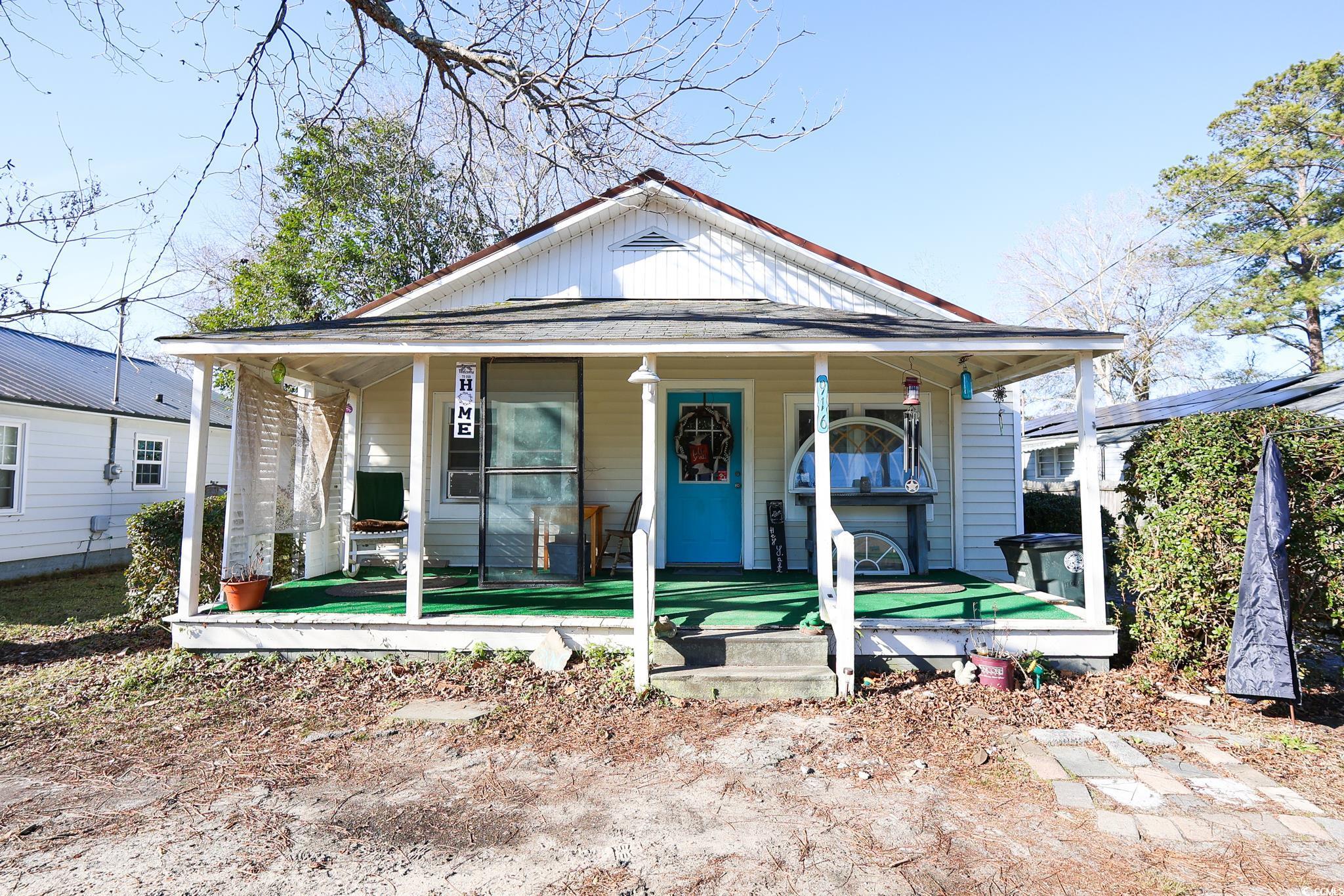 916 Maple Street Mullins, SC 29574 - Photo 1 of 11 View of front of home with covered porch