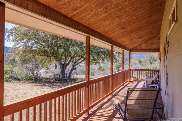a view of balcony with wooden floor
