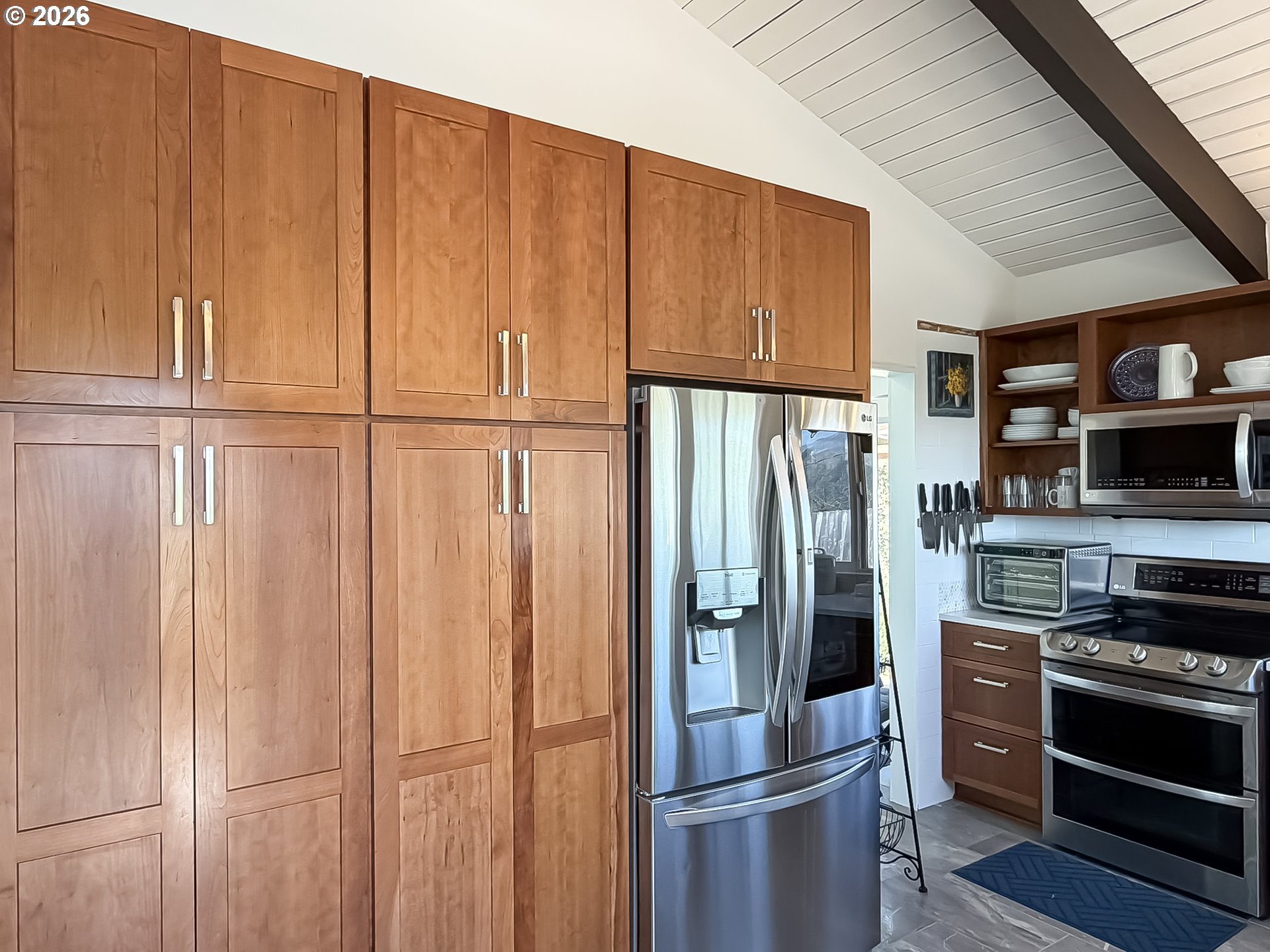 895 Marina Heights Road Brookings, OR 97415 - Photo 13 of 48 a kitchen with stainless steel appliances granite countertop a refrigerator and a stove top oven
