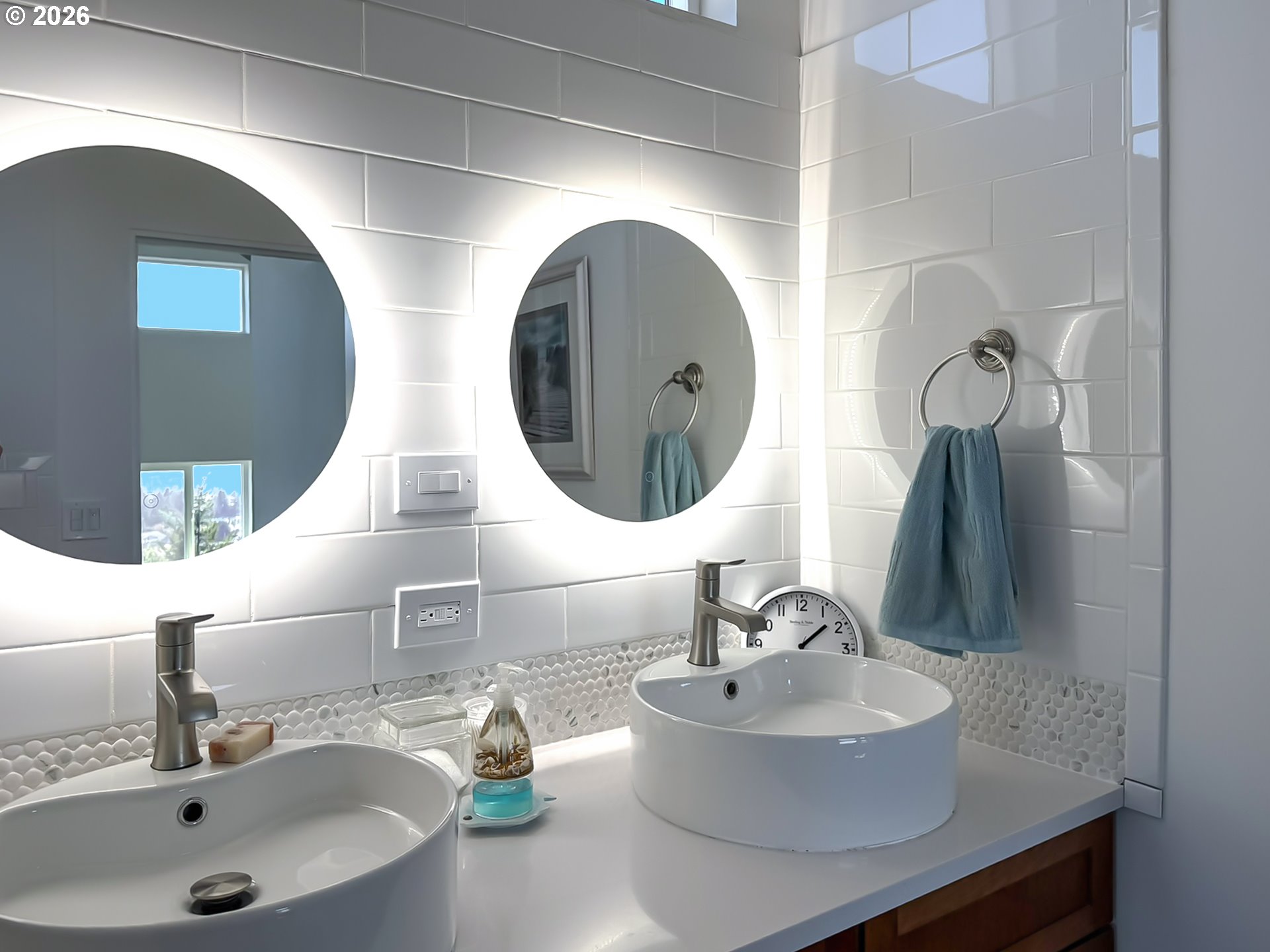 895 Marina Heights Road Brookings, OR 97415 - Photo 24 of 48 a bathroom with a sink and a mirror