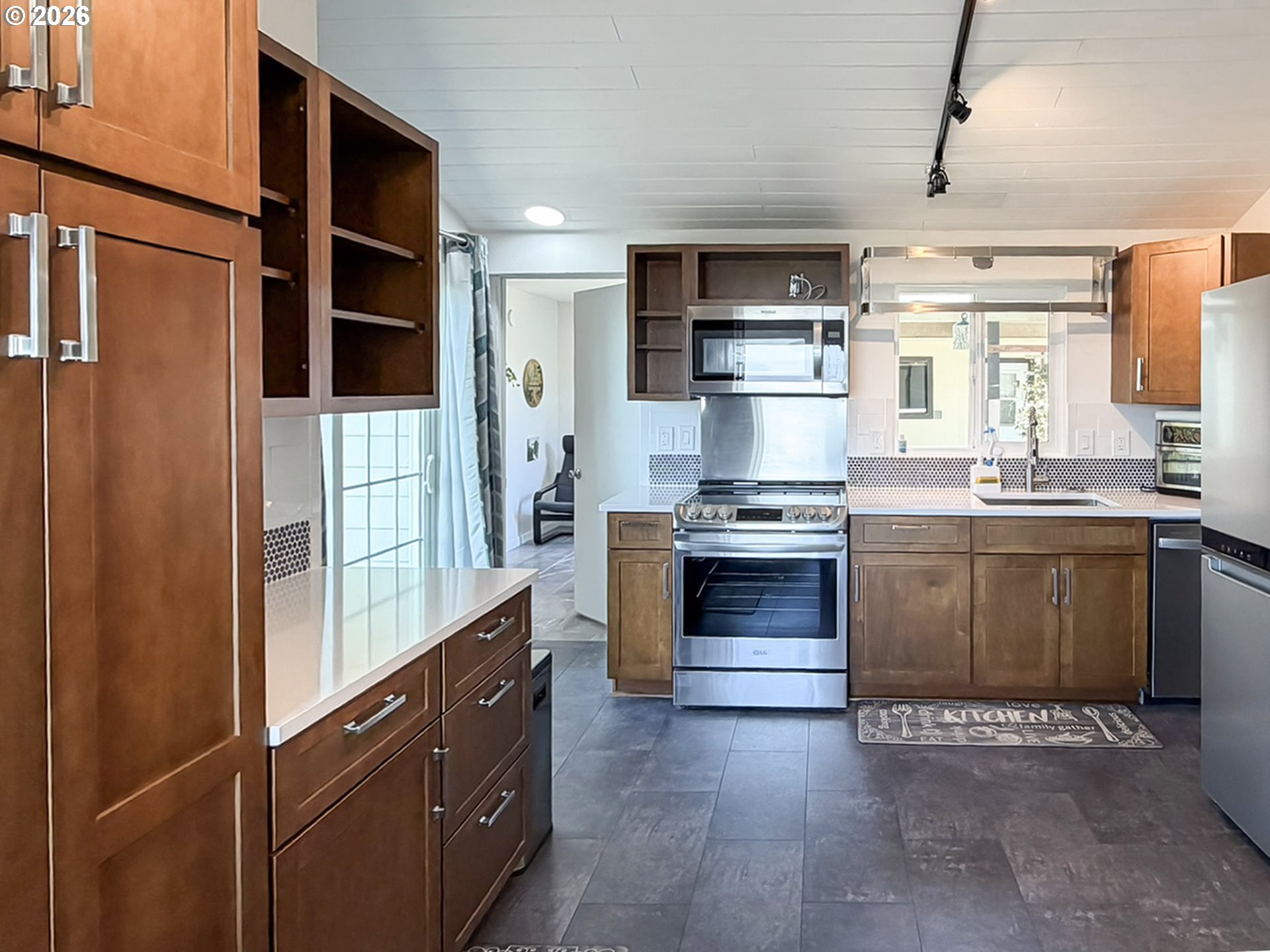 895 Marina Heights Road Brookings, OR 97415 - Photo 36 of 48 a kitchen with stainless steel appliances a stove sink and refrigerator